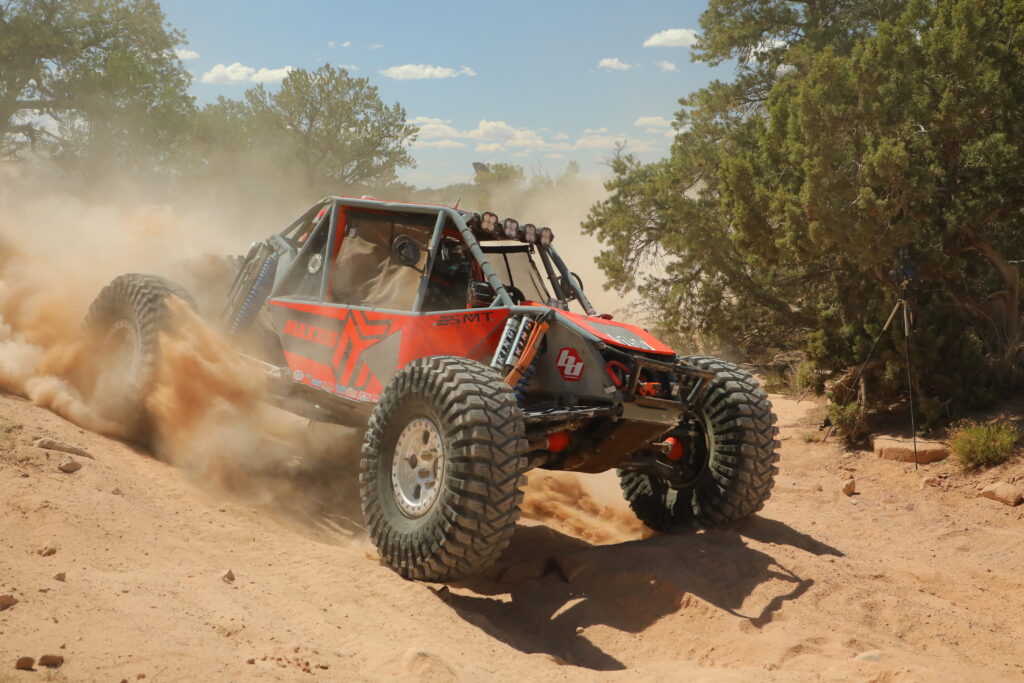 Maxxis sponsored athlete, action shot of car in the dirt.