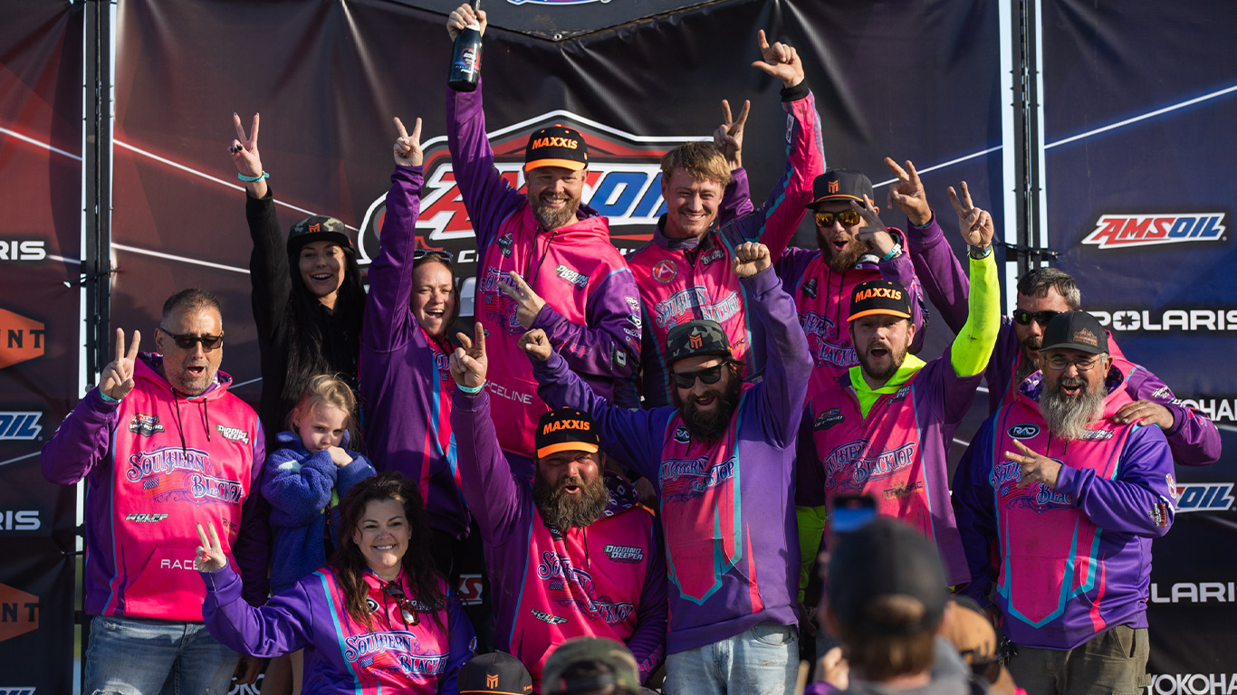 Maxxis athlete and team celebrating at CHAMP offroad