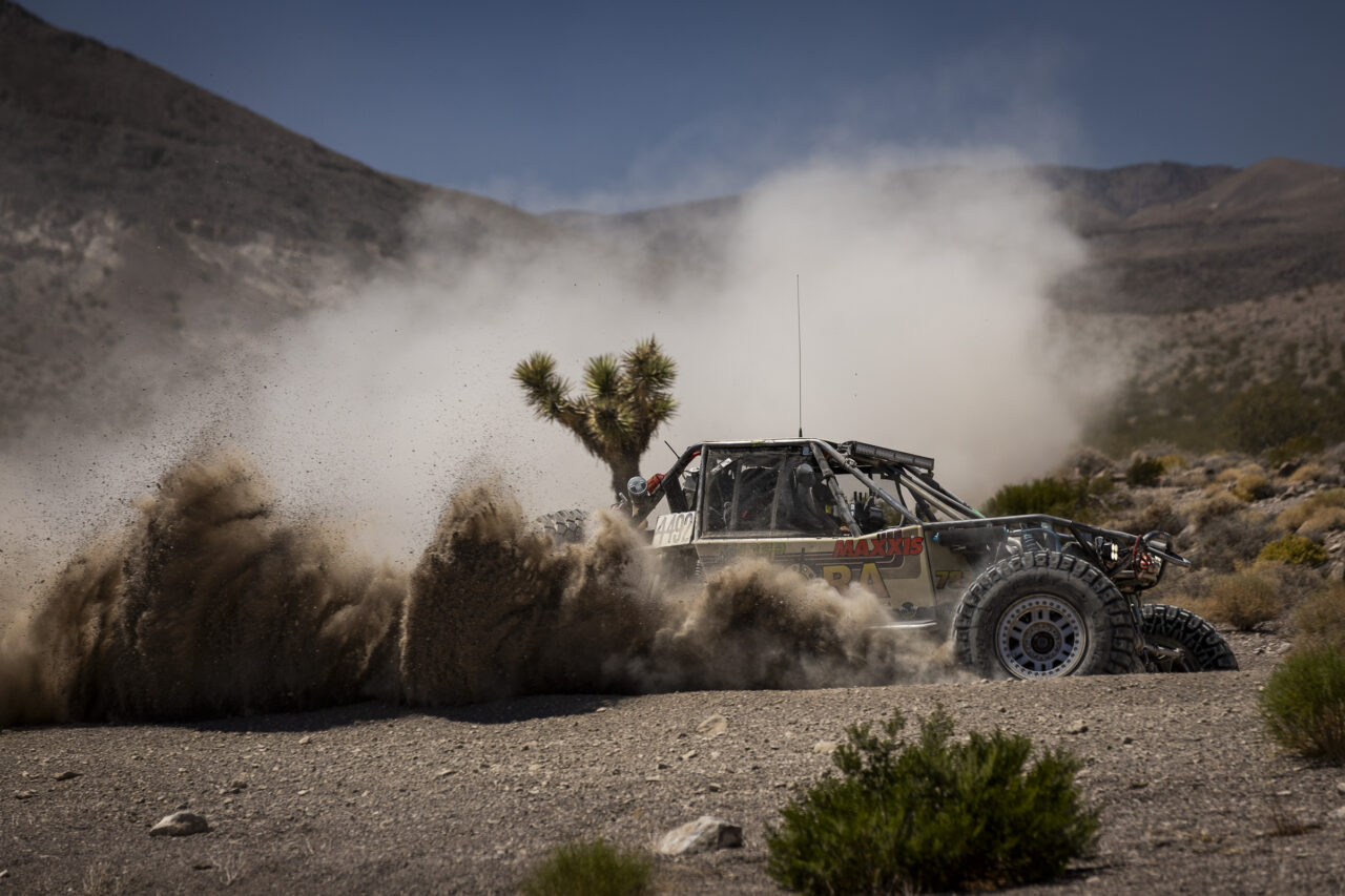 4400 Maxxis athlete Justin Wicks matted in his race car wizzing through trees of Joshua.