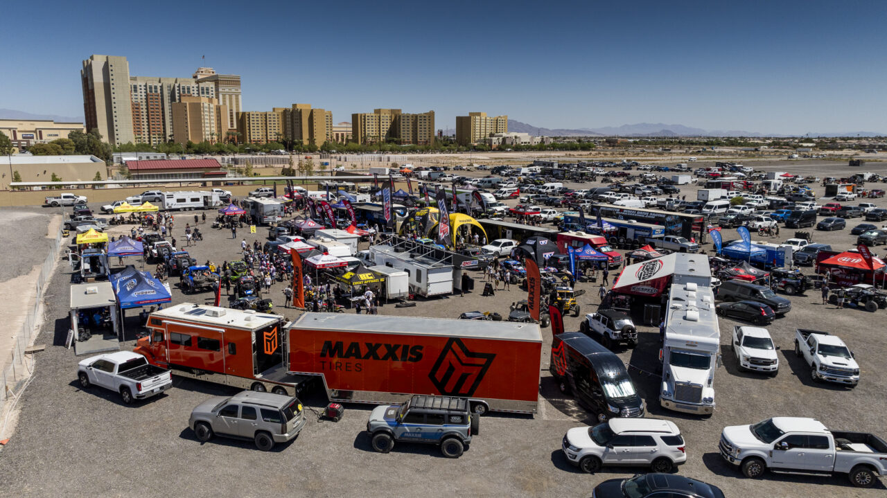 Huge parking lot filled with all of the Desert Race industry on a V2R tech and contingency day. The vegas city skyline in the background.