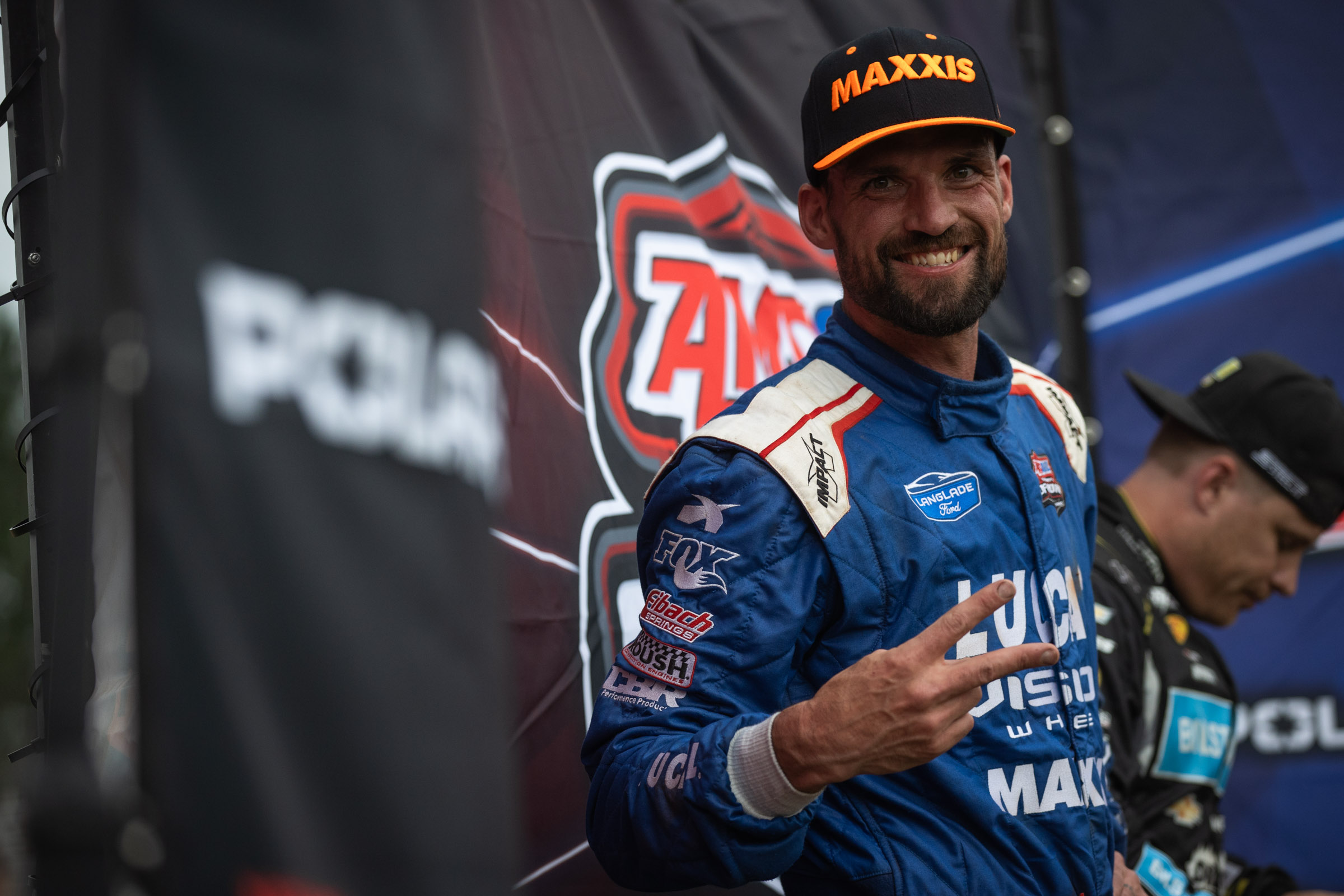 Maxxis athlete kincaid holding up a 2