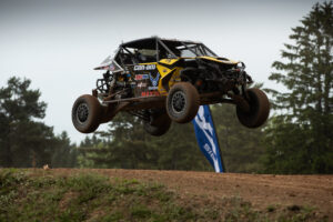 Maxxis athlete racing on the track