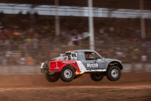Maxxis athlete racing on the track