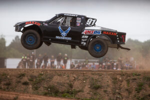 Maxxis athlete racing on the track