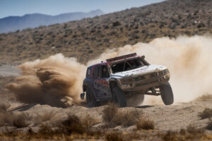 HRC Honda Passport Trick Truck Mid Race and wide open toting the front wheels under heavy acceleration.