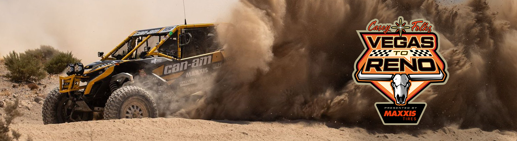 Dustin Jones pinned in his SxS running right to left across the image. It looks like he is trying to escape the dust that is consuming his race car.