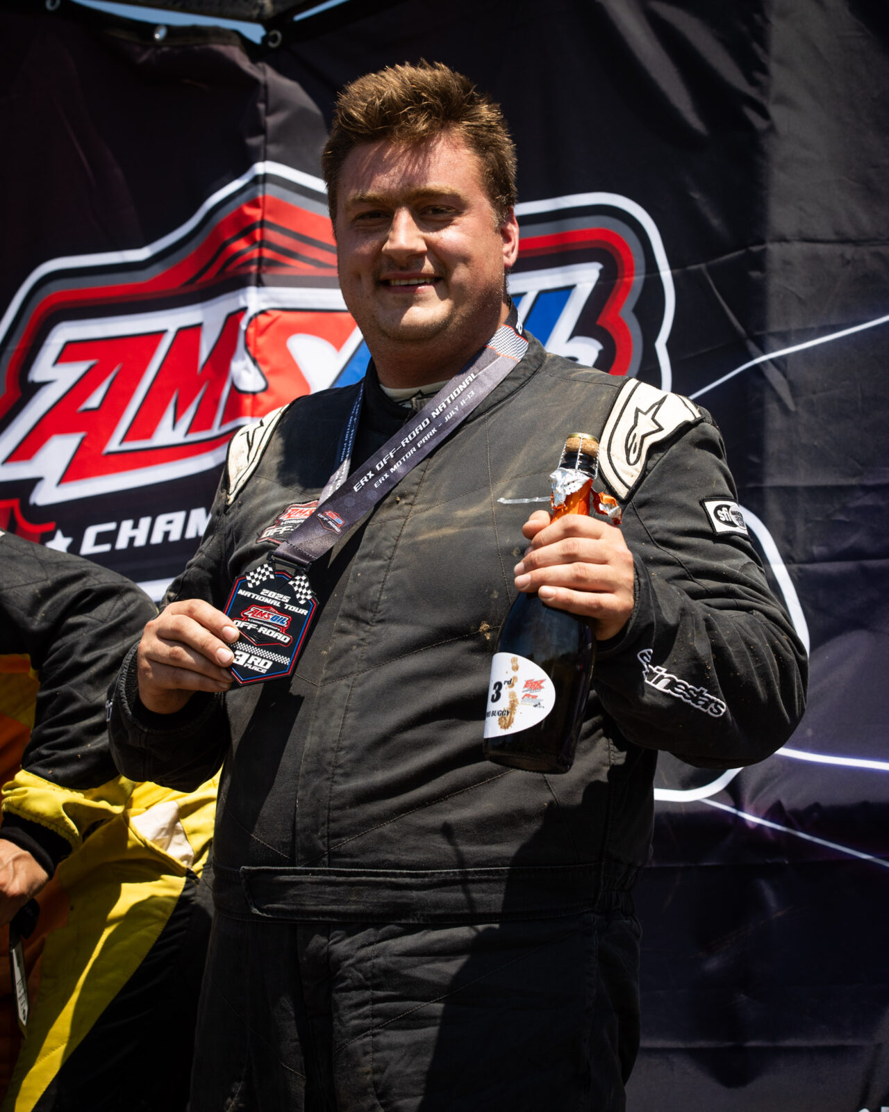 maxxis sponsored athlete on the podium