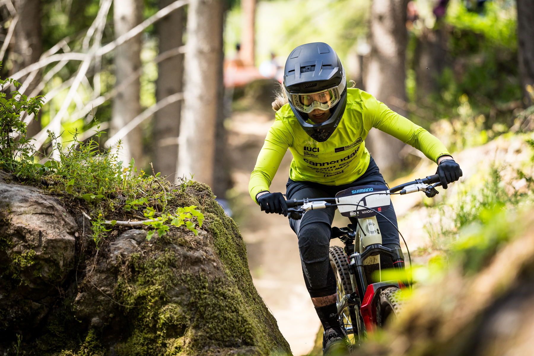 Ella Conolly squeezes her way past a boulder