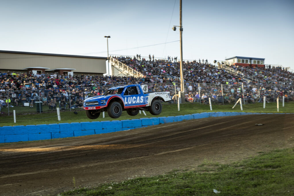 maxxis athlete doing a huge jump in front of the crowd