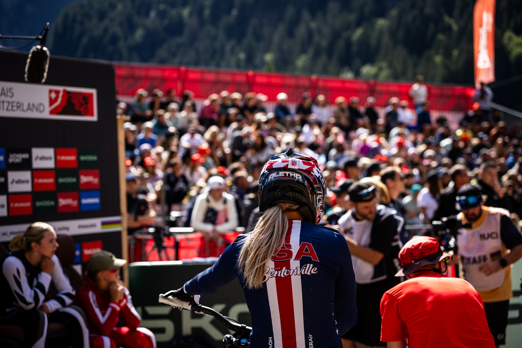 View from behind of crowd and USA Athlete