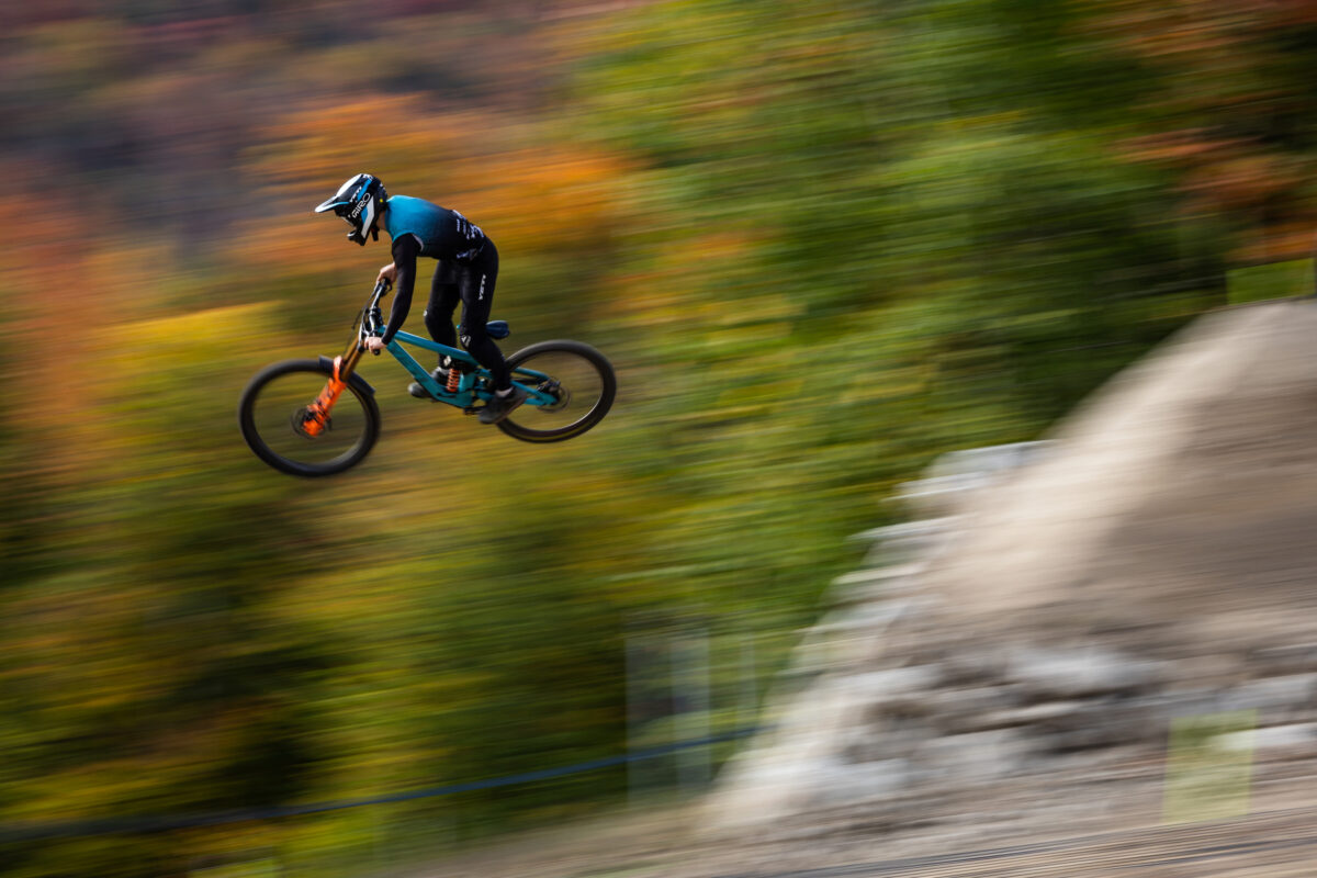 Yeti Rider jumping off rock
