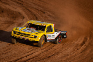 Maxxis athlete driving through the track
