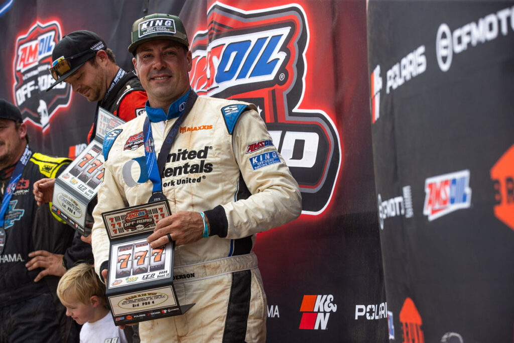 Maxxis athlete Jimmy henderson with Thomas in the background. Standing on podium