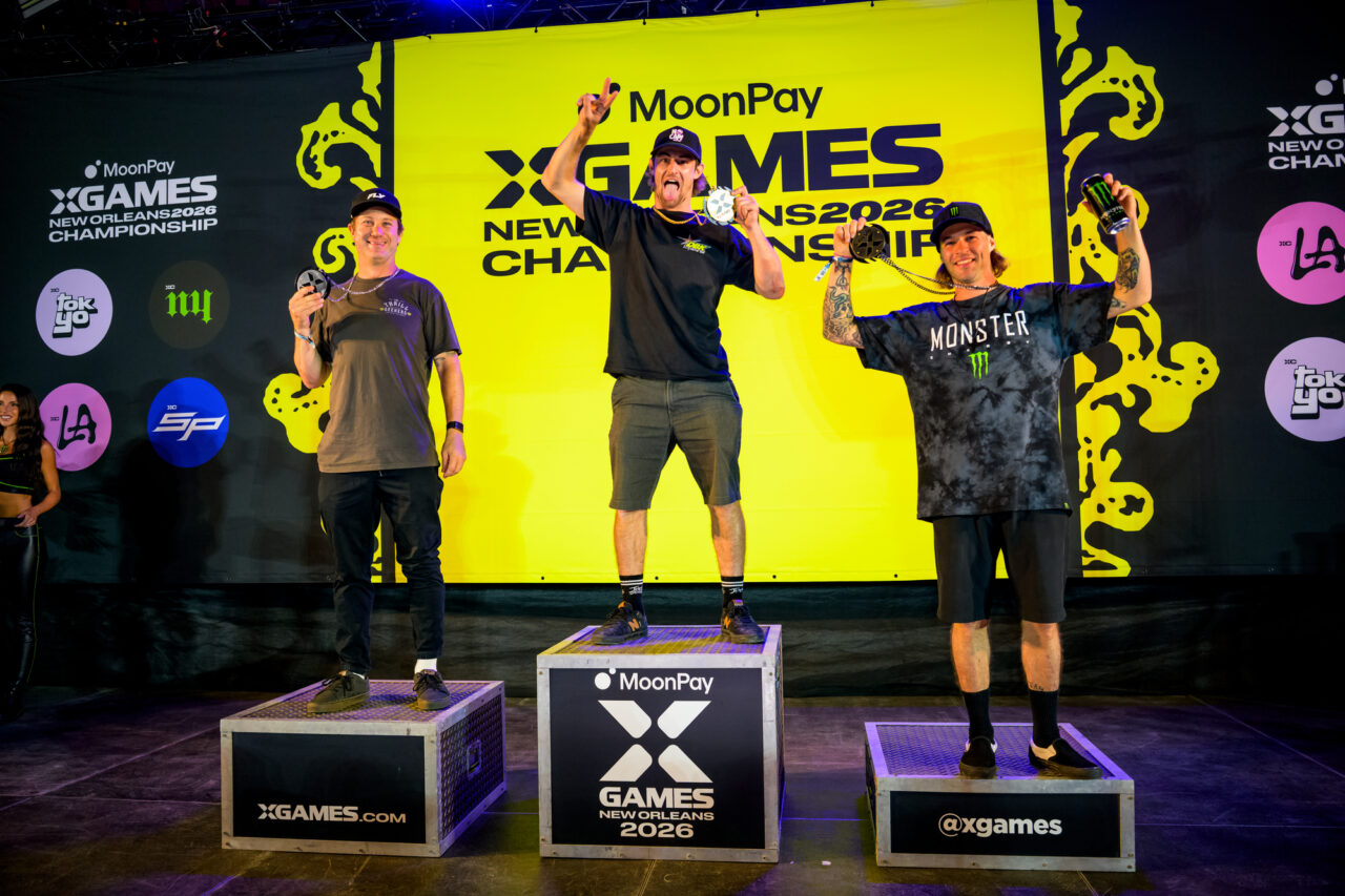 WYO on the podium holding his first Gold Medal with a very toothy smile.