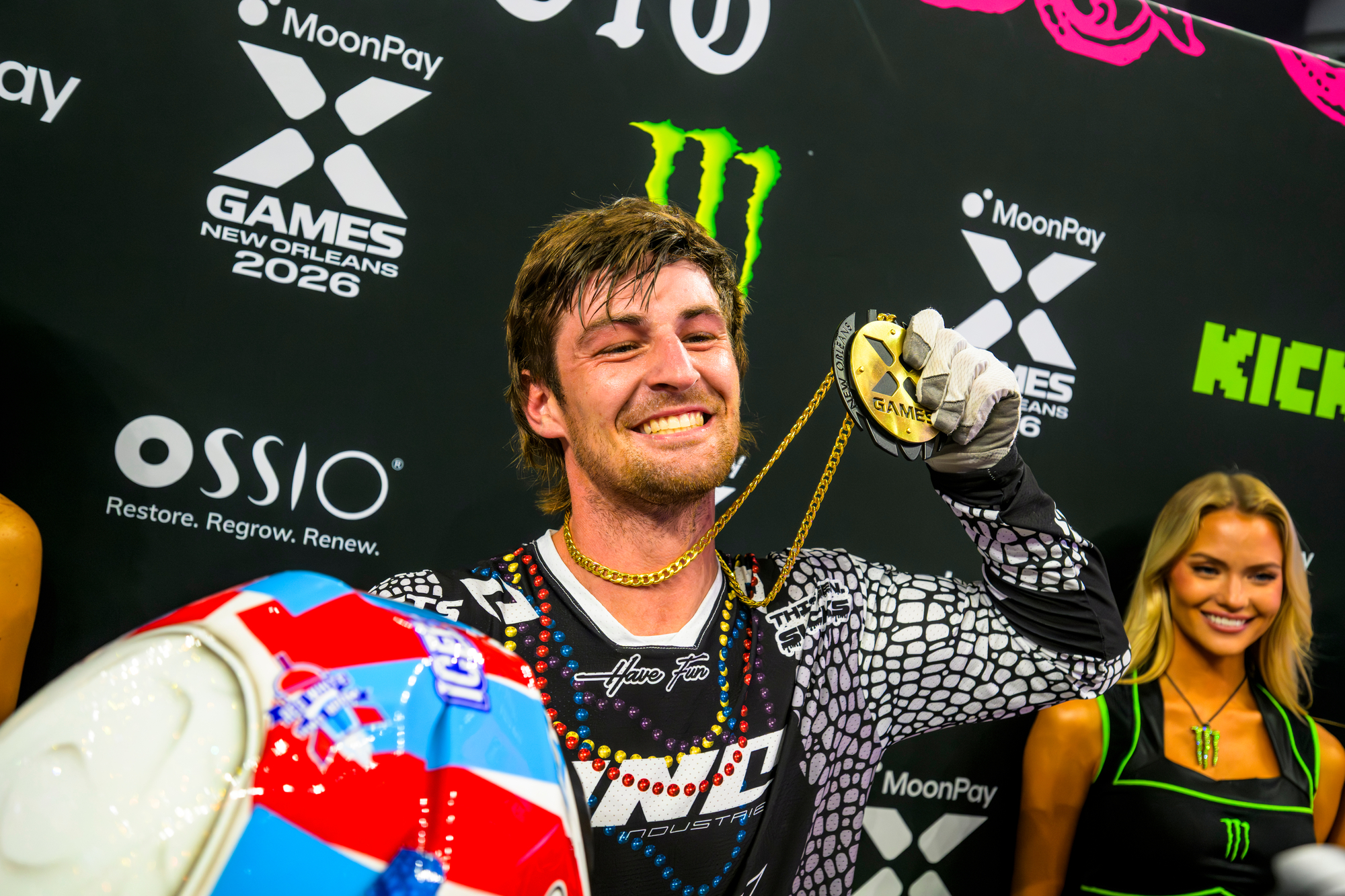 WYO on the podium holding his first Gold Medal with a very toothy smile.