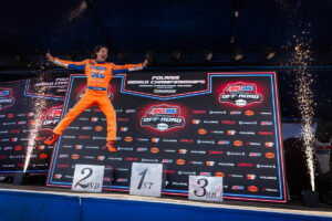 Maxxis athlete jumping on stage