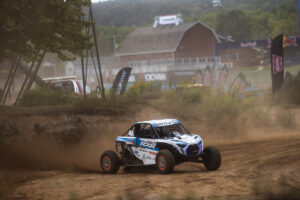 Maxxis sxs sliding through a corner