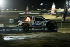 Jimmy Hendersons car getting some air on course